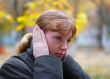 Woman cover your ears by hands