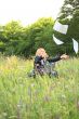 Businesswoman on nature catch documents