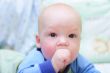 Baby draw your fist into the mouth