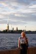 Girl sitting on canal border in Saint Petersburg