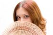 Girl close your face by fan