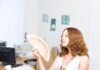 Girl brush away face by fan #1
