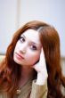 Portrait of girl with reddish hair in office