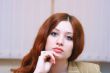 Girl with reddish hair in office #3