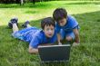 Two cute boy study on computer