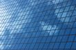 sky reflecting in windows of office building