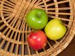 Apples on wicker plate