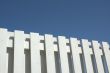 white fence against blue sky