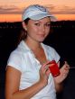 The young girl with a red thin mobile phone