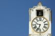 ancient clock over blue sky with space for text