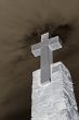 stone cross over blue sky