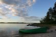 view of the lake with green boat on the coast