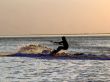 Silhouette of a kitesurf on a gulf on a sunset 2