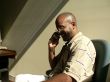 African American man on cellphone in the shadows