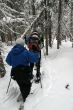 Blue parka, snowshoe hikers