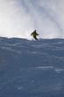 Yellow skier in powder snow