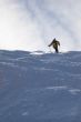 Yellow skier in powder snow