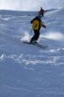 Yellow skier in powder snow