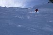 Red skier in powder snow