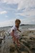 Girl on cloudy coast