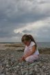 Girl on cloudy coast