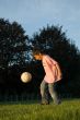 boy plays with ball