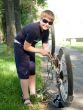 boy repairs a bicycle