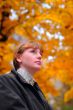 Woman look forward in autumn park #1
