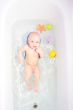 Baby in bath with toys
