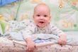 Baby rest on bed and look at camera #2