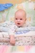 Baby rest on bed and look at camera #5