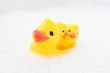 Three rubber ducks in foam water #3