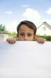 Boy keeps sheet of paper