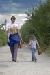 Mother and daughter are walking away