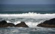 Waves breaking on volcanic rock