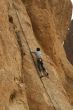 Climber on sheer rock face