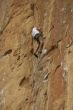 Climber on sheer rock face