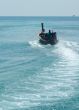 fisherman in a longtail boat