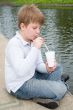 little boy drinks a milkshake