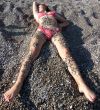 The sexual girl in a pebble on a beach2