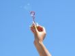 Female hand and soap bubbles