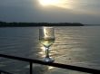 Glass of white wine on a background of a sunset