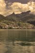 Hotels and mountains on coast of lake.