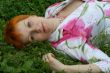 red-haired girl on a grass