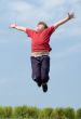 A little boy jumps