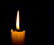 candle flame over black background with copyspace