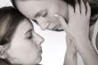 Holding her face