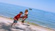 Mother and Son playing at the beach