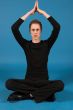 Portrait of a caucasian man in a yoga position