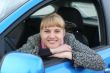 Blonde girl in a blue car